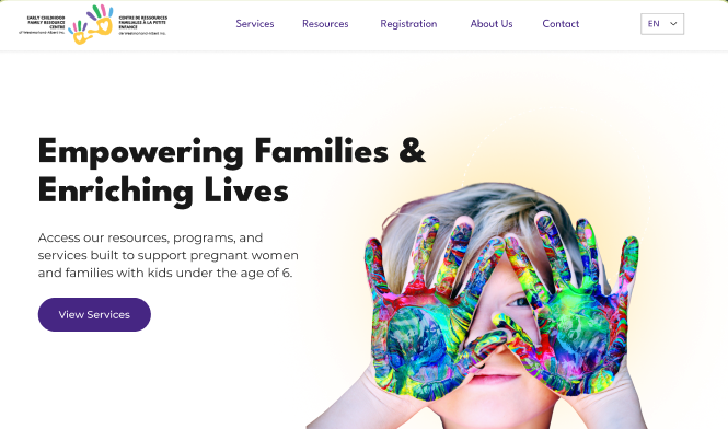 The redesigned centre website — 'Empowering Families & Enriching Lives' with vibrant painted-hands imagery and bilingual navigation